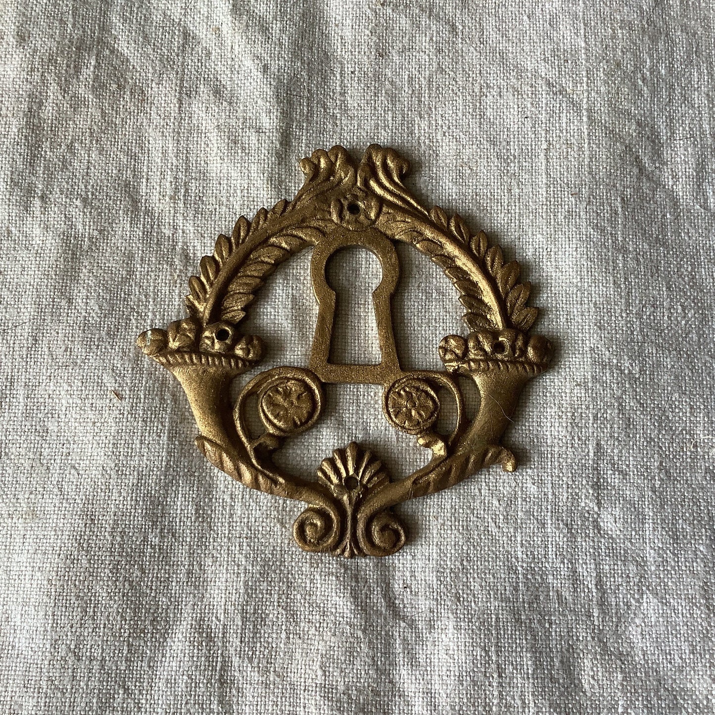 One Antique Brass Ormolu Keyhole Cover Escutcheon made in France in the 1920s elegant