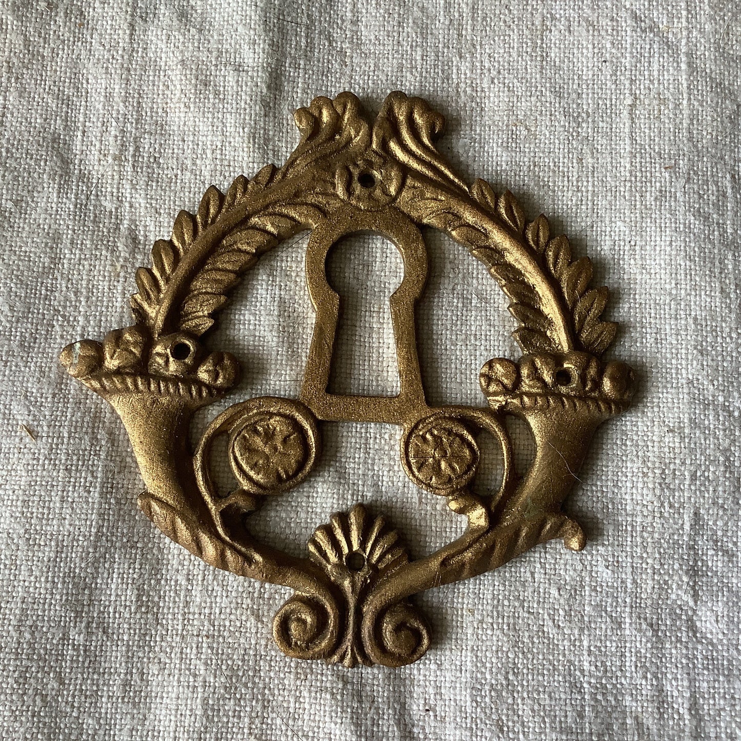 One Antique Brass Ormolu Keyhole Cover Escutcheon made in France in the 1920s elegant