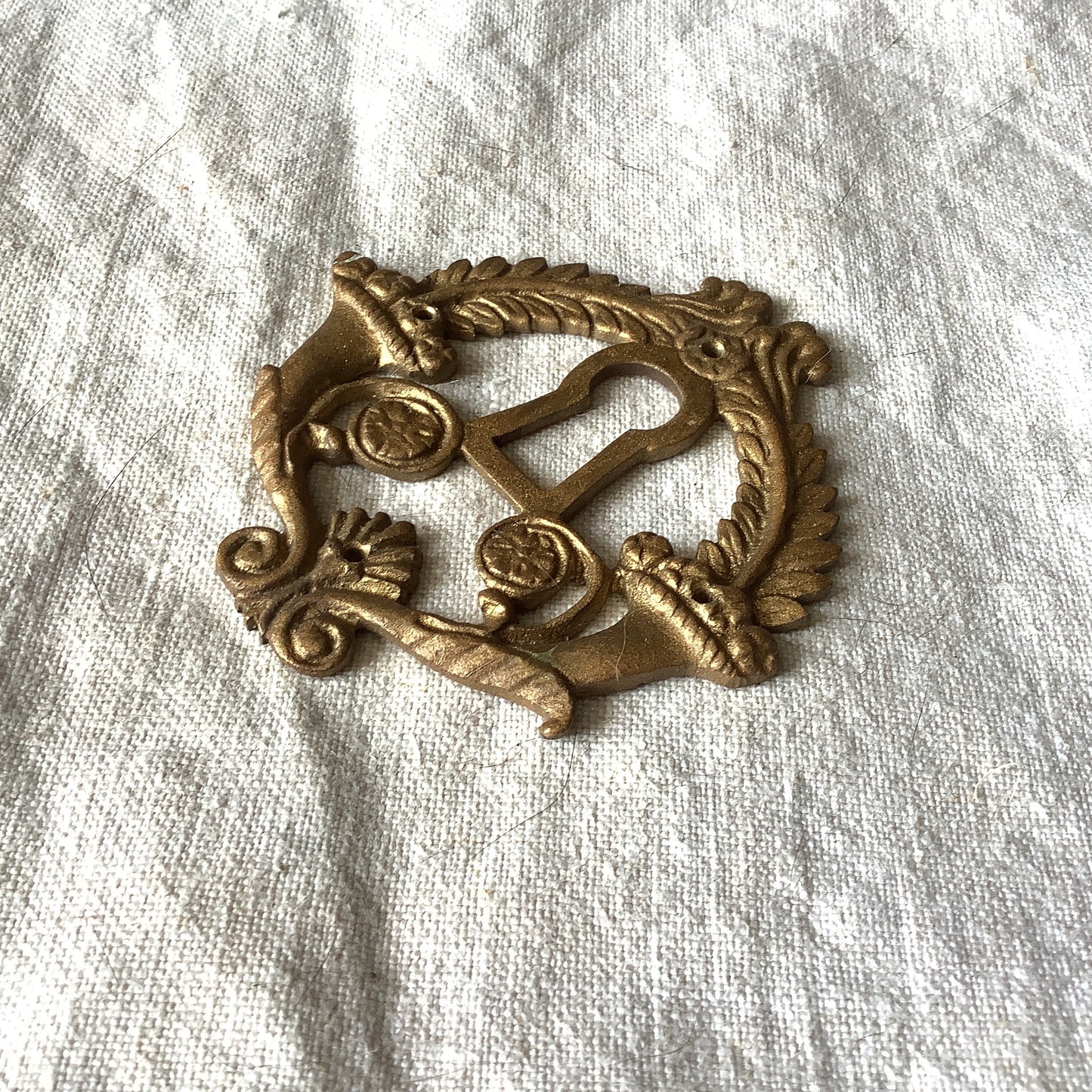 One Antique Brass Ormolu Keyhole Cover Escutcheon made in France in the 1920s elegant