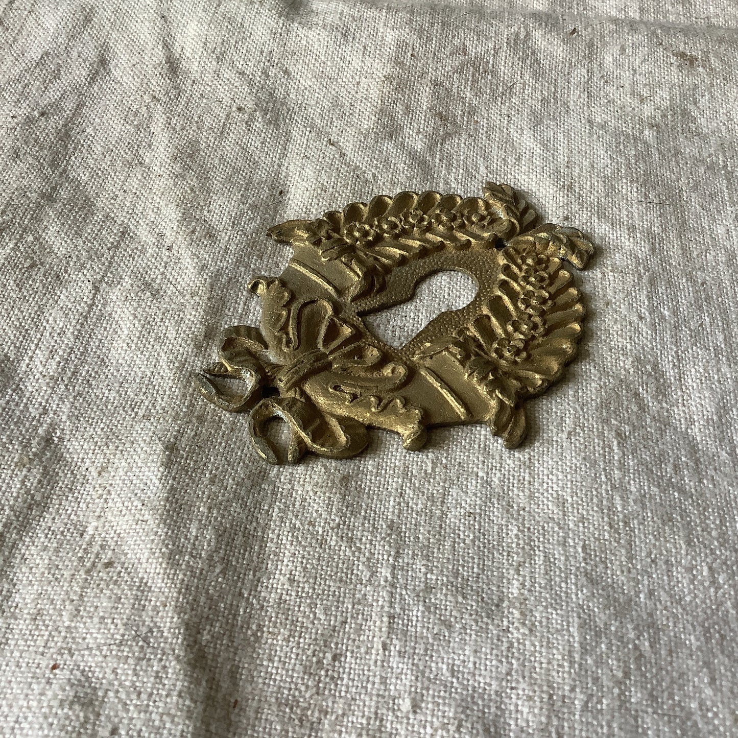 One Antique Brass Keyhole Cover made in France in the 1900s