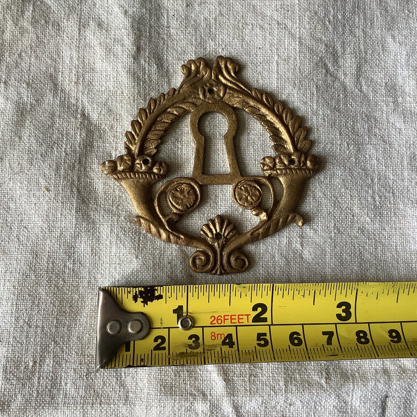 One Antique Brass Ormolu Keyhole Cover Escutcheon made in France in the 1920s elegant