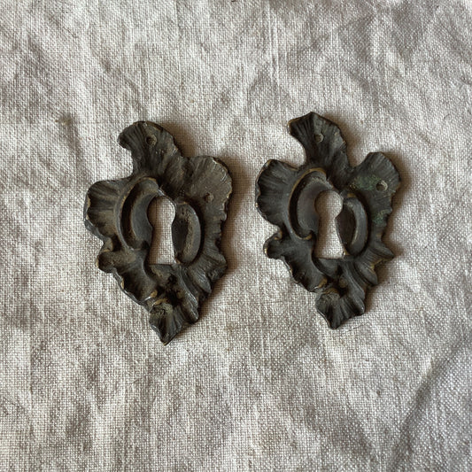 A set of Two matching Antique Brass Keyhole Cover made in France in the 1900s Black with patina