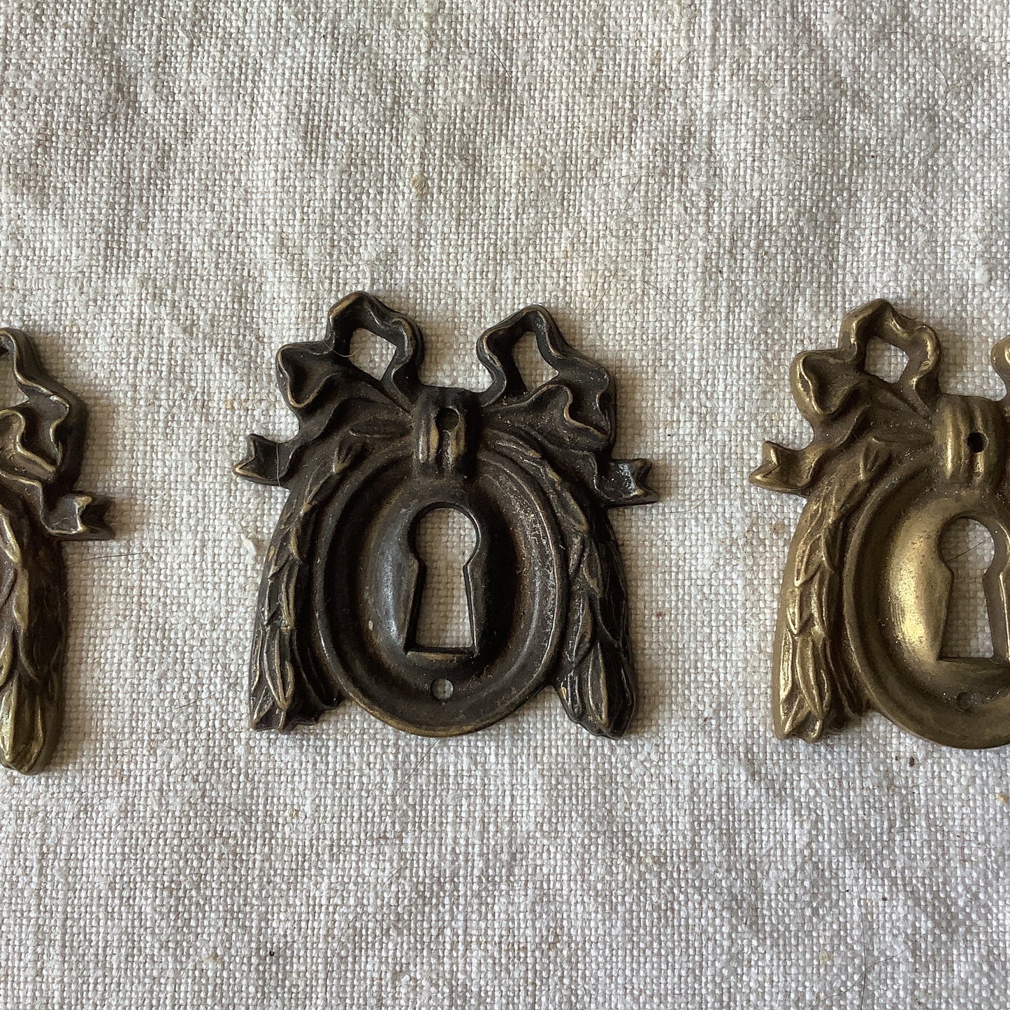 A set of Three matching Antique Brass Keyhole Cover made in France in the 1900s