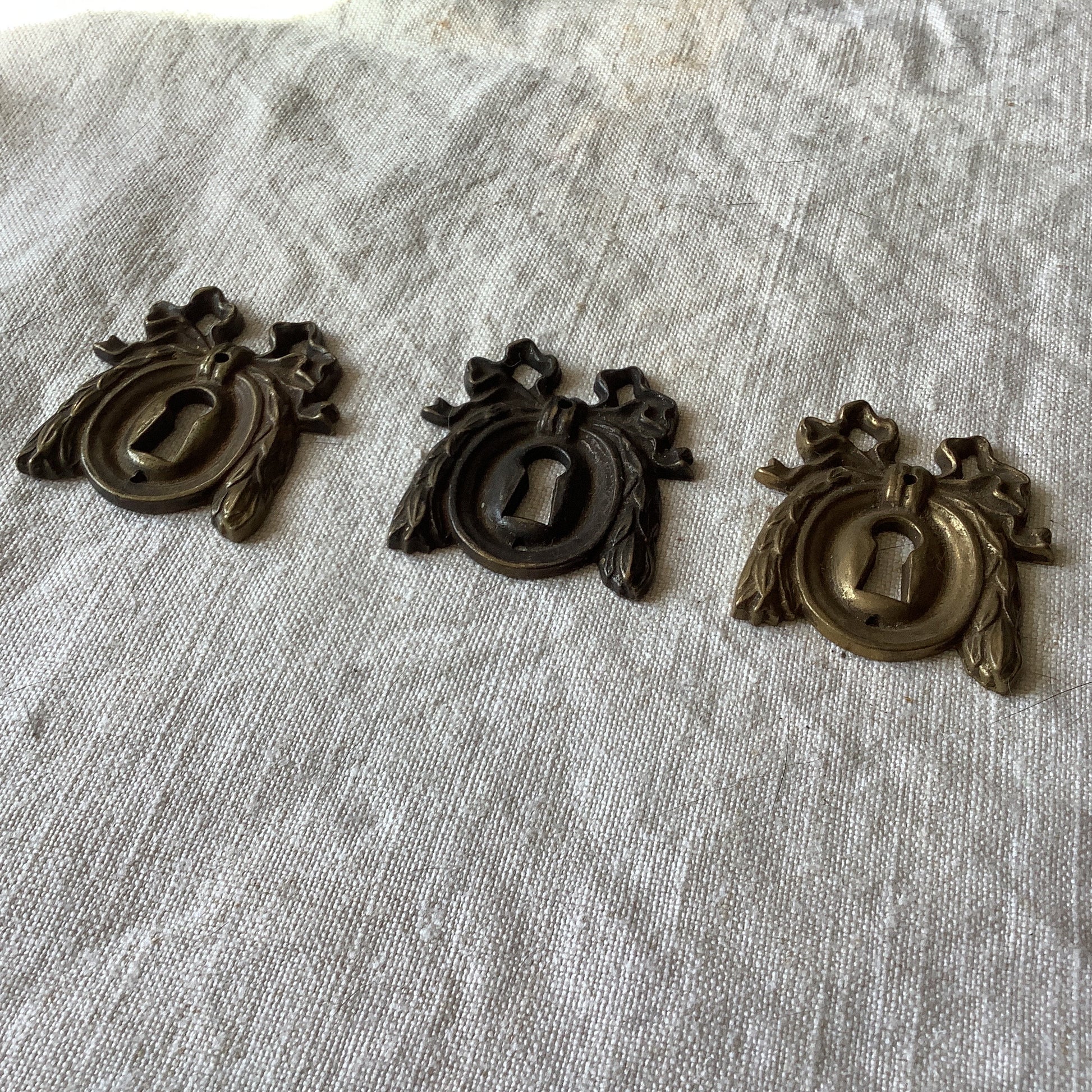 A set of Three matching Antique Brass Keyhole Cover made in France in the 1900s