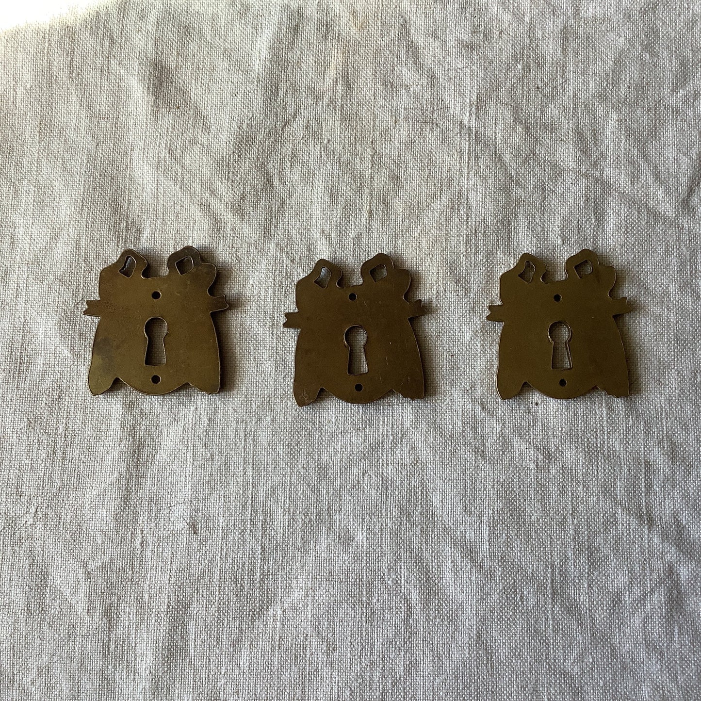 A set of Three matching Antique Brass Keyhole Cover made in France in the 1900s