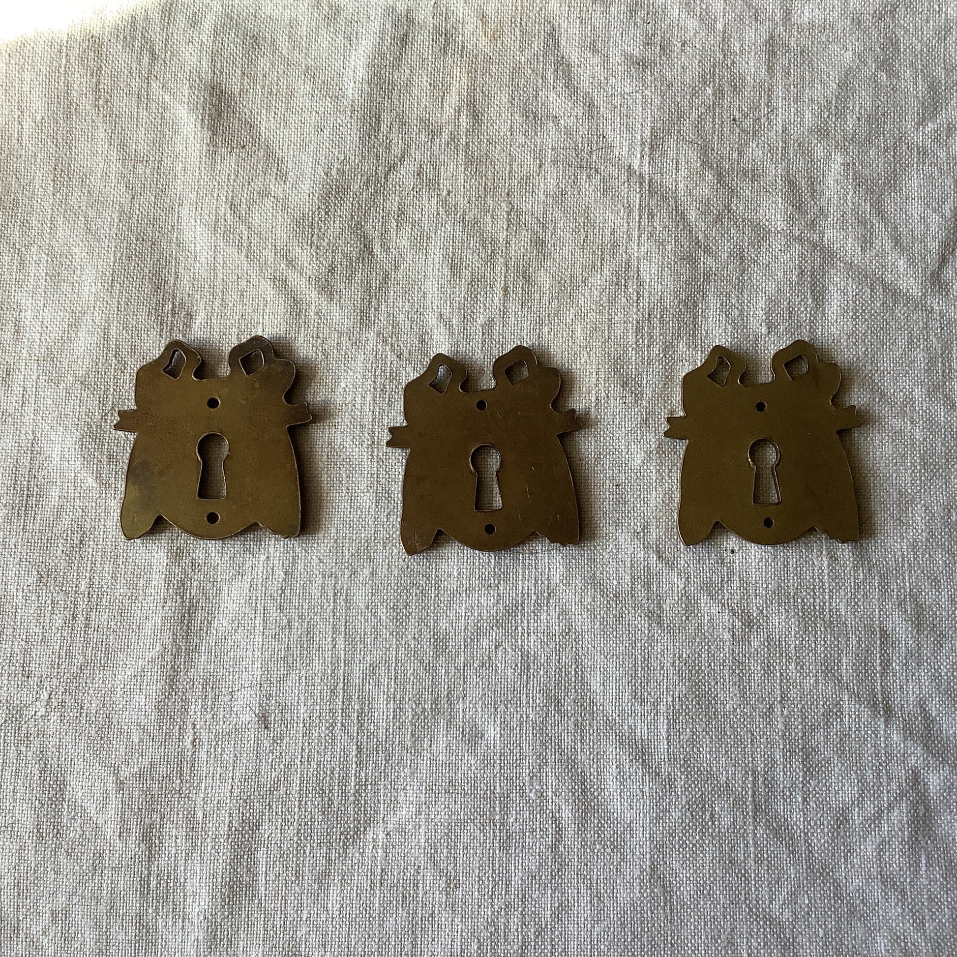 A set of Three matching Antique Brass Keyhole Cover made in France in the 1900s