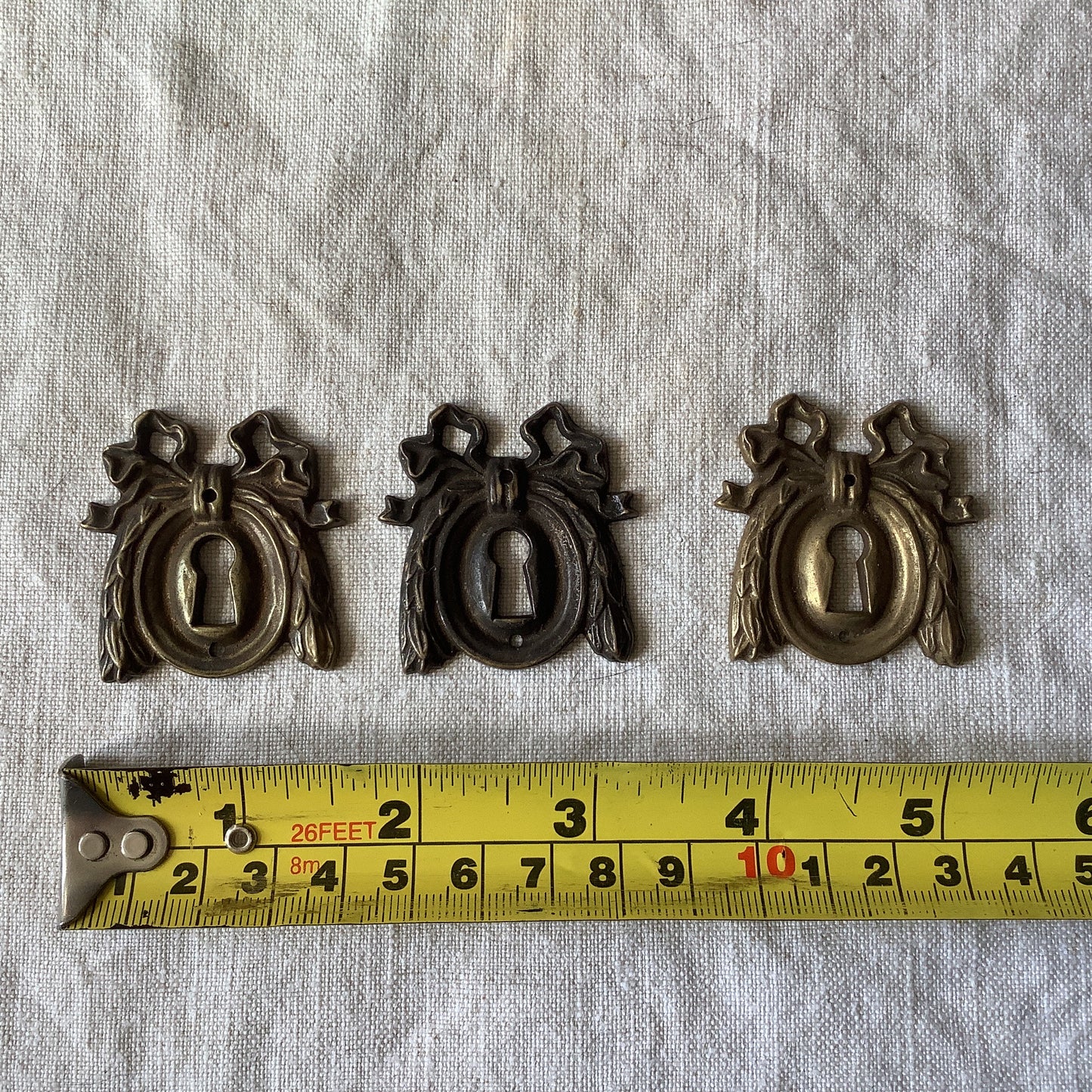 A set of Three matching Antique Brass Keyhole Cover made in France in the 1900s