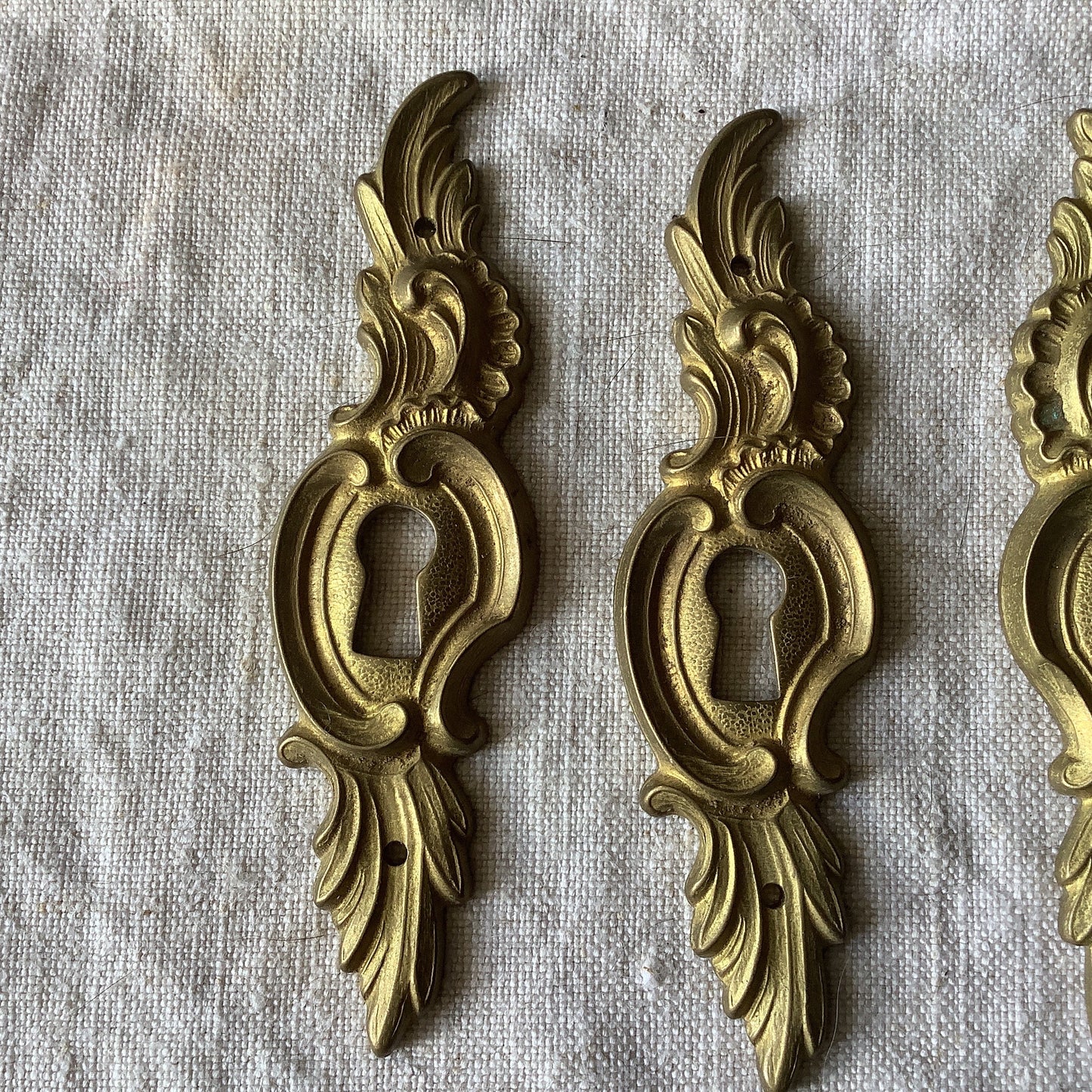 A set of Three matching Antique Brass Keyhole Cover made in France in the 1900s