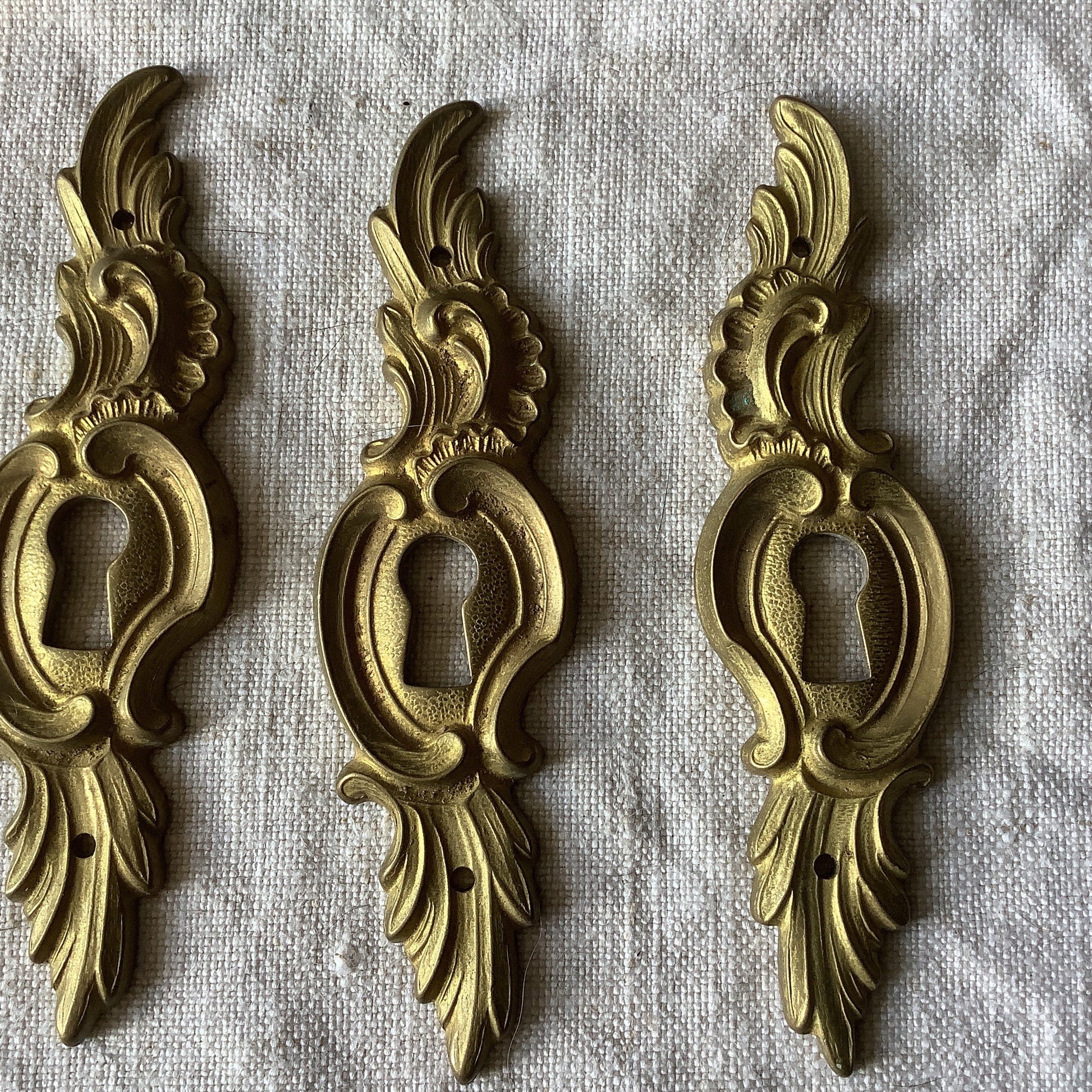 A set of Three matching Antique Brass Keyhole Cover made in France in the 1900s