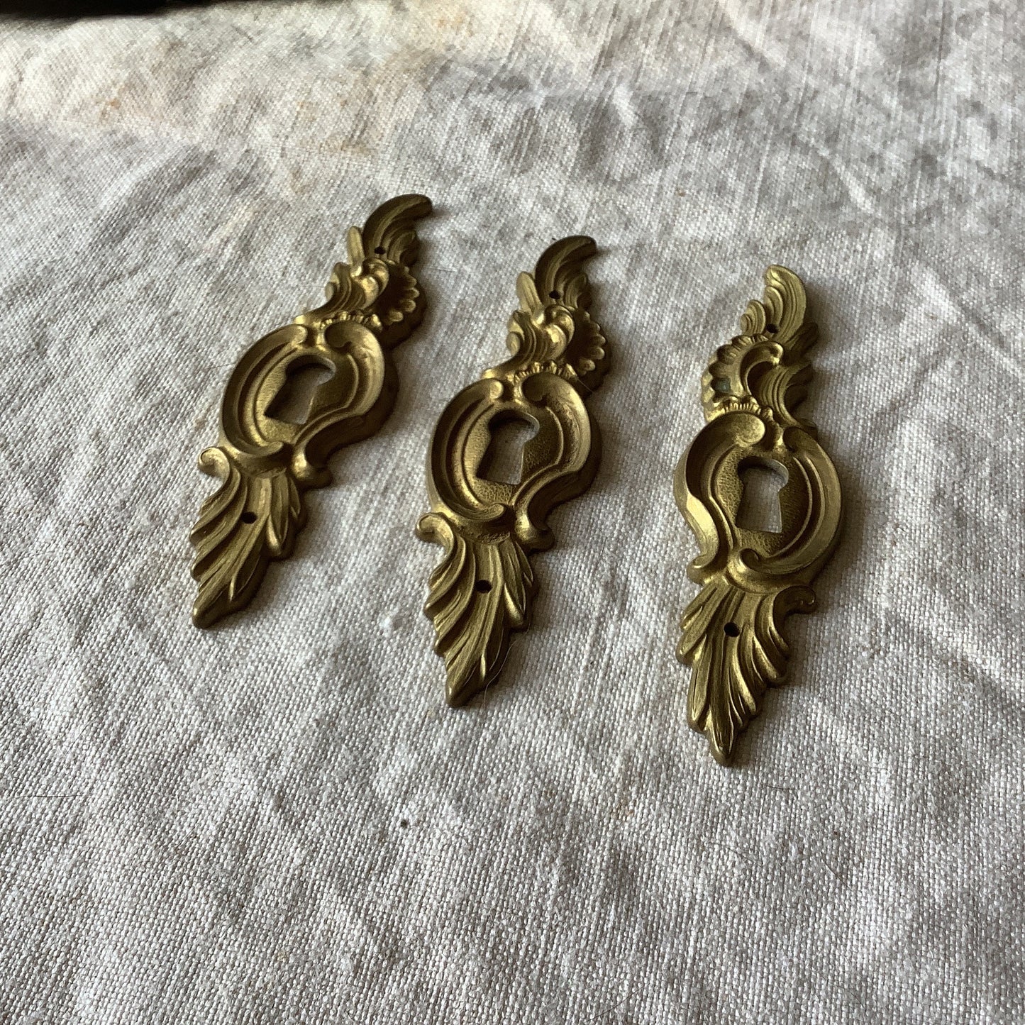 A set of Three matching Antique Brass Keyhole Cover made in France in the 1900s