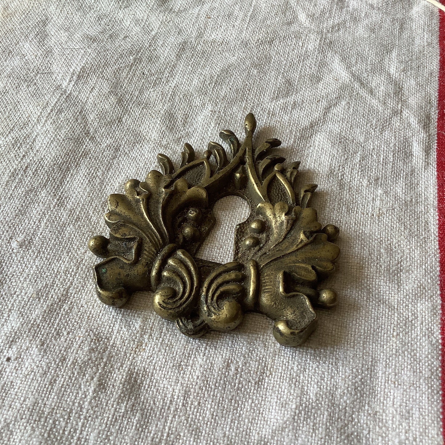 One Antique Brass Keyhole Cover made in France in the 1900s