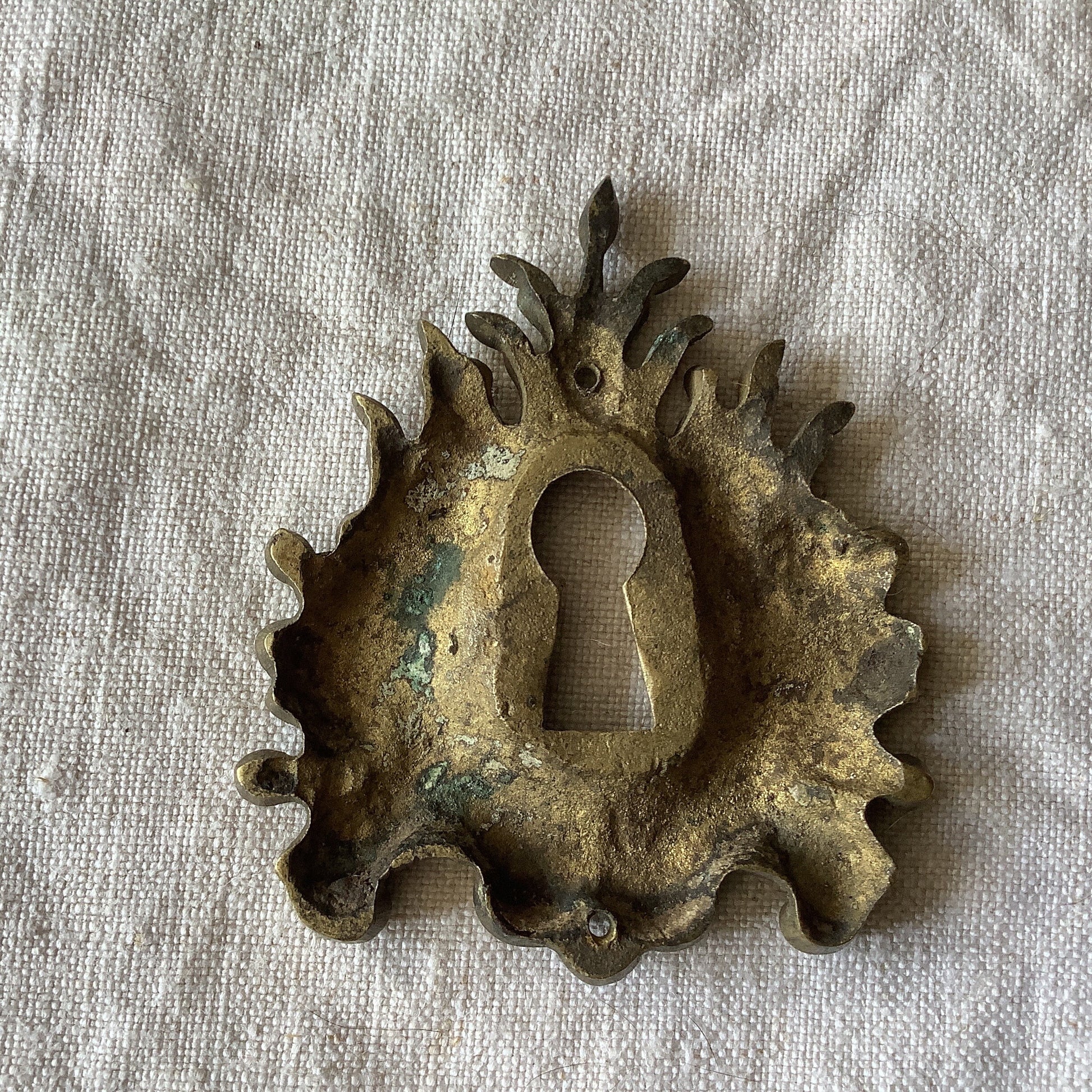 One Antique Brass Keyhole Cover made in France in the 1900s