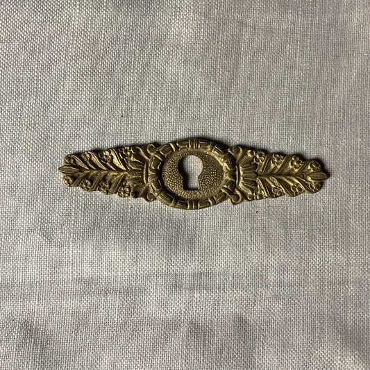 One Antique Brass Ormolu Keyhole Cover Escutcheon made in France in the 1900s