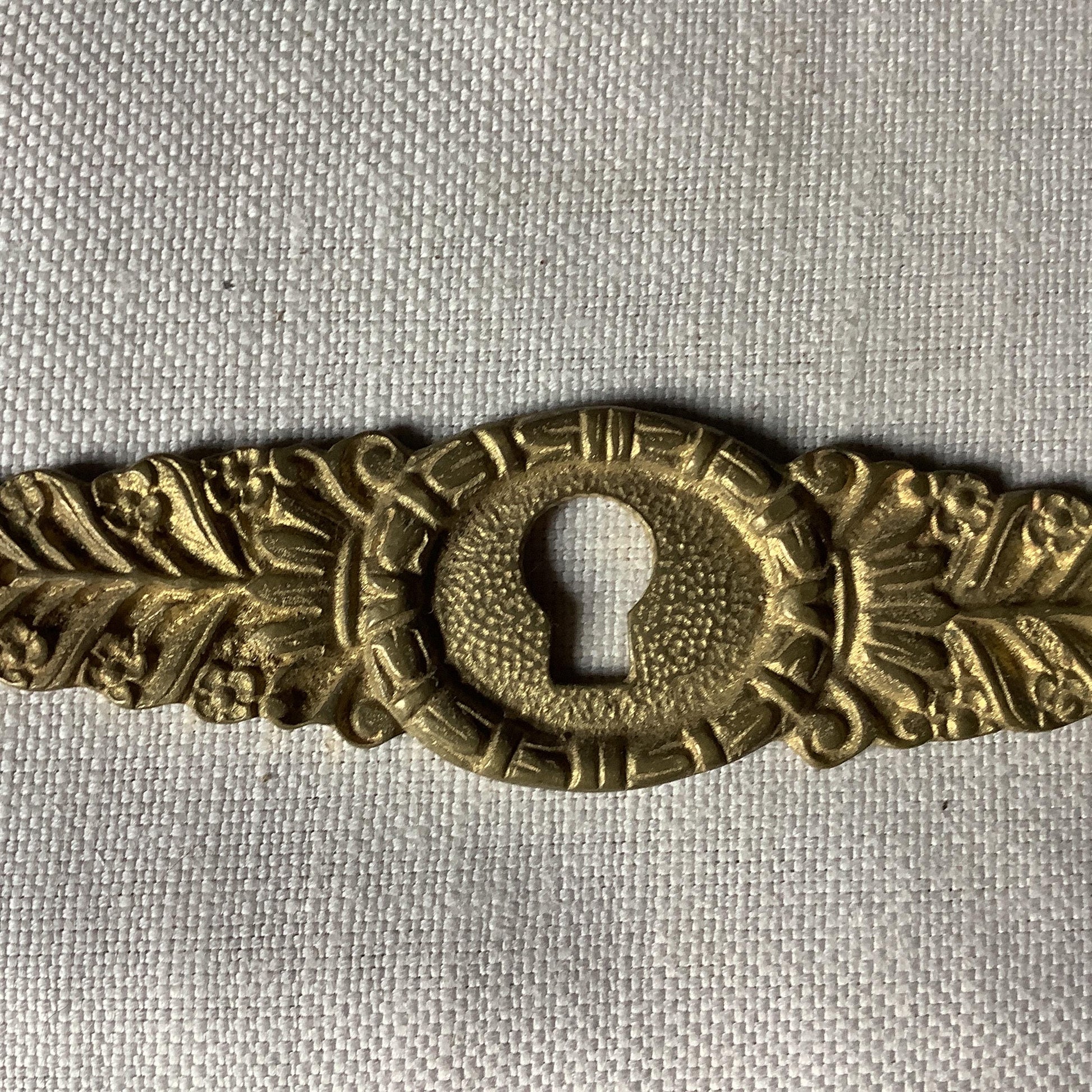 One Antique Brass Ormolu Keyhole Cover Escutcheon made in France in the 1900s