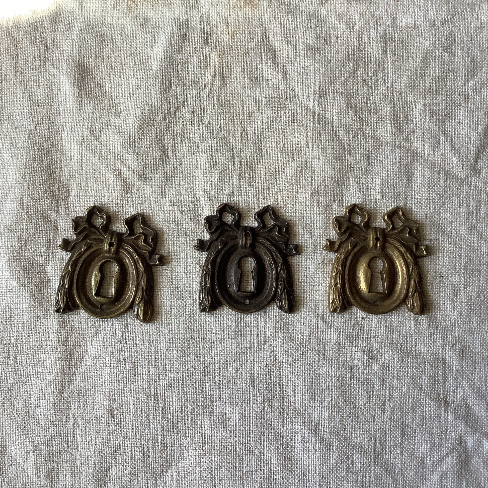 A set of Three matching Antique Brass Keyhole Cover made in France in the 1900s