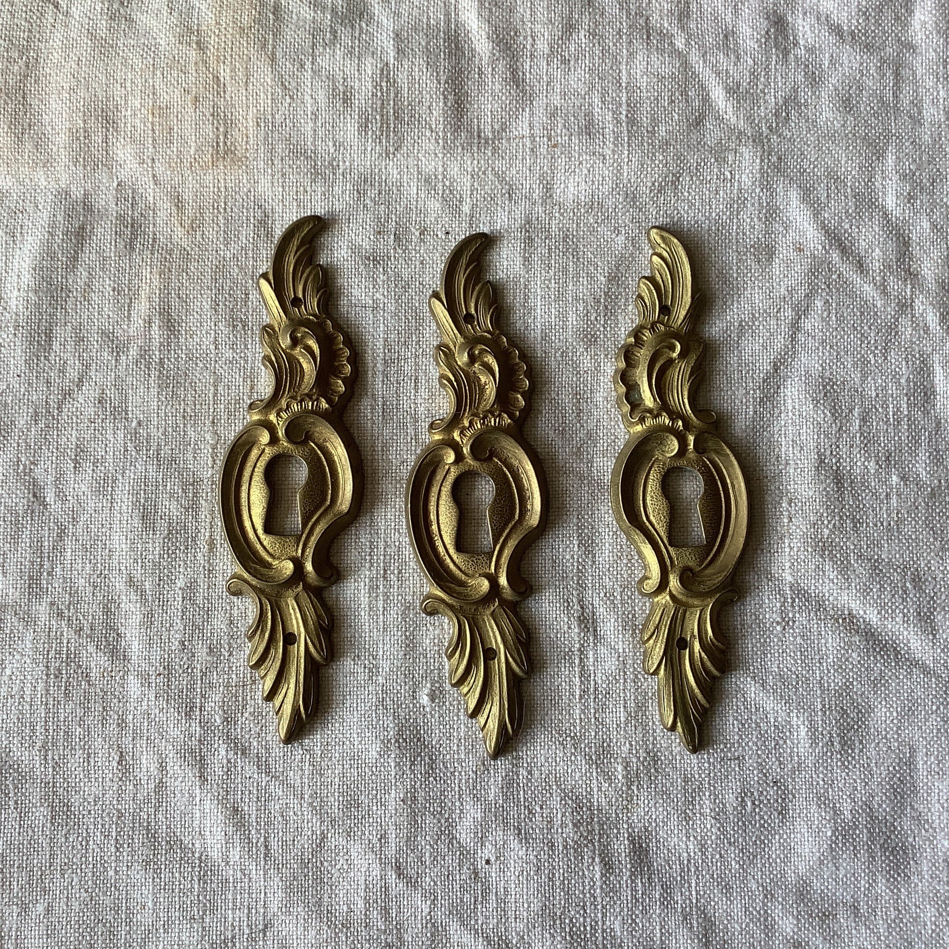 A set of Three matching Antique Brass Keyhole Cover made in France in the 1900s