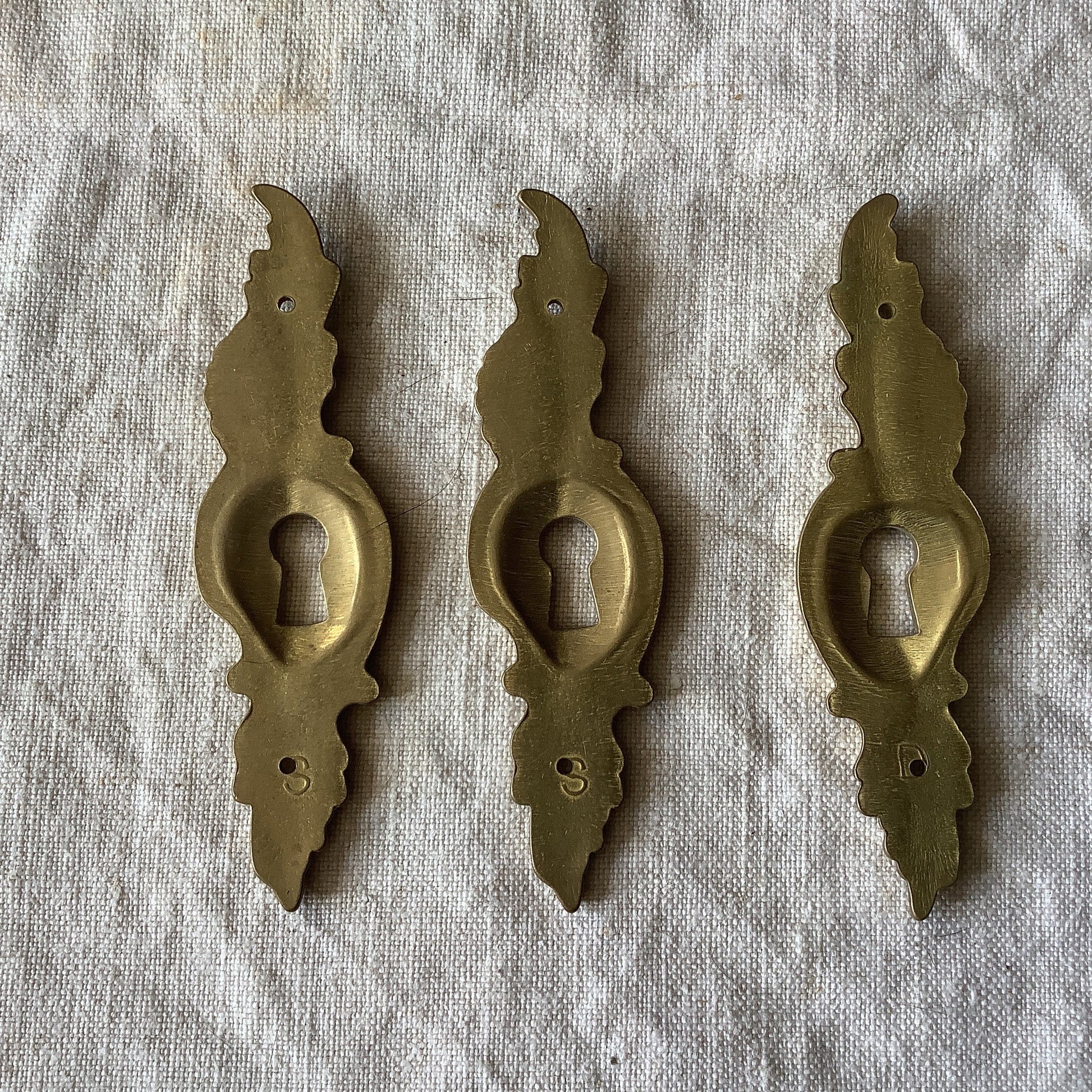 A set of Three matching Antique Brass Keyhole Cover made in France in the 1900s