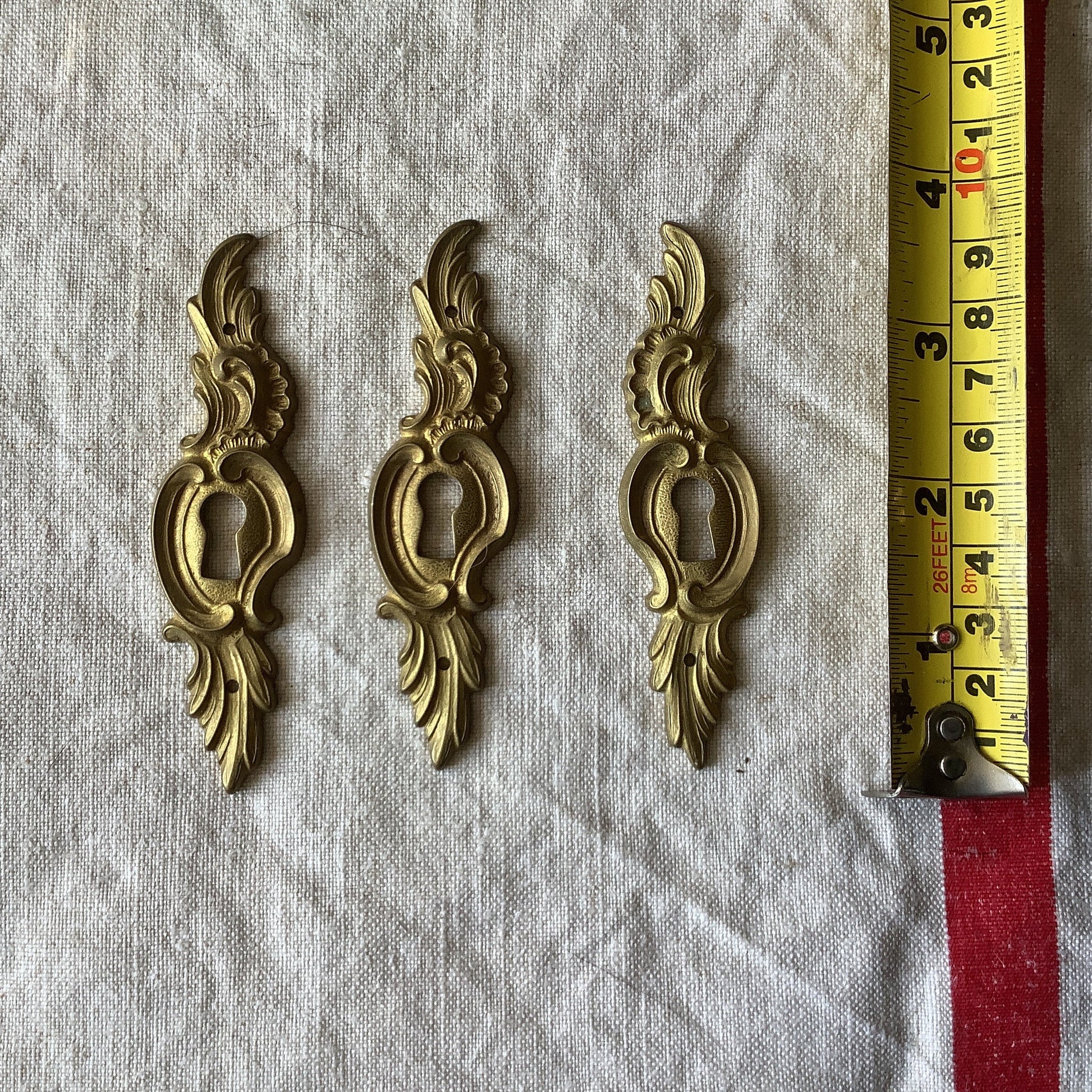 A set of Three matching Antique Brass Keyhole Cover made in France in the 1900s