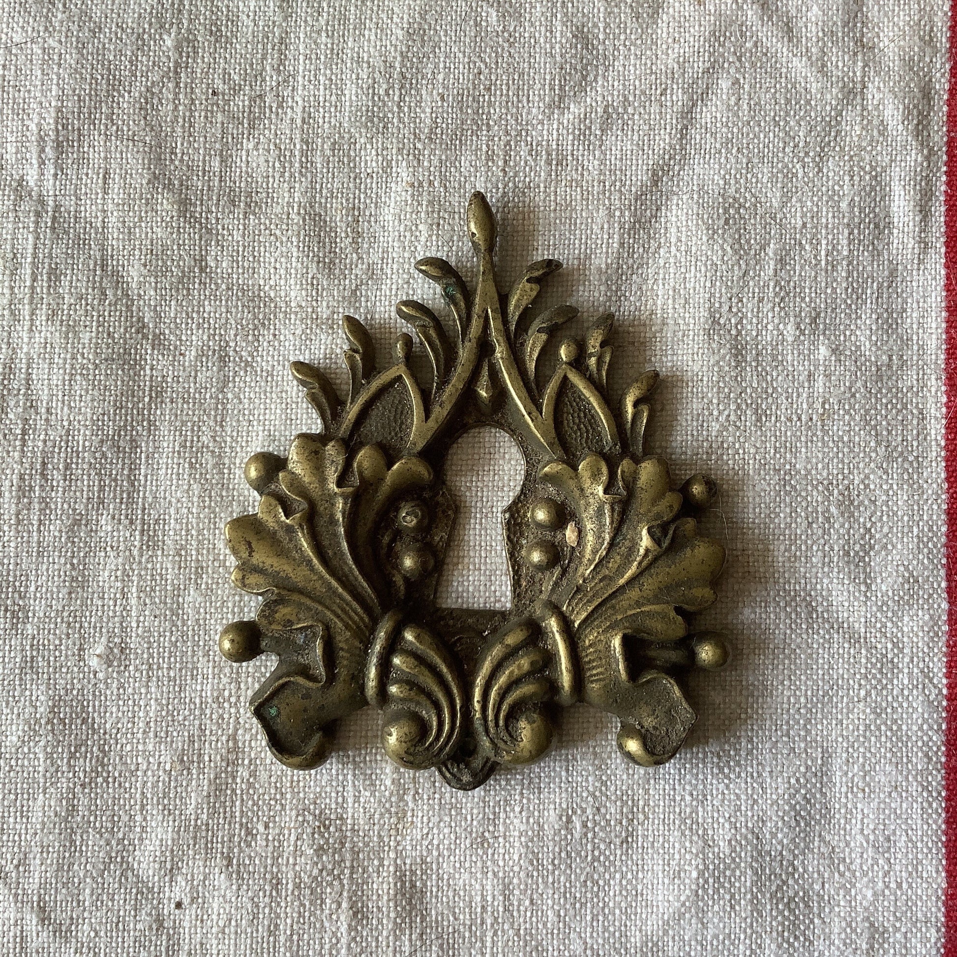 One Antique Brass Keyhole Cover made in France in the 1900s