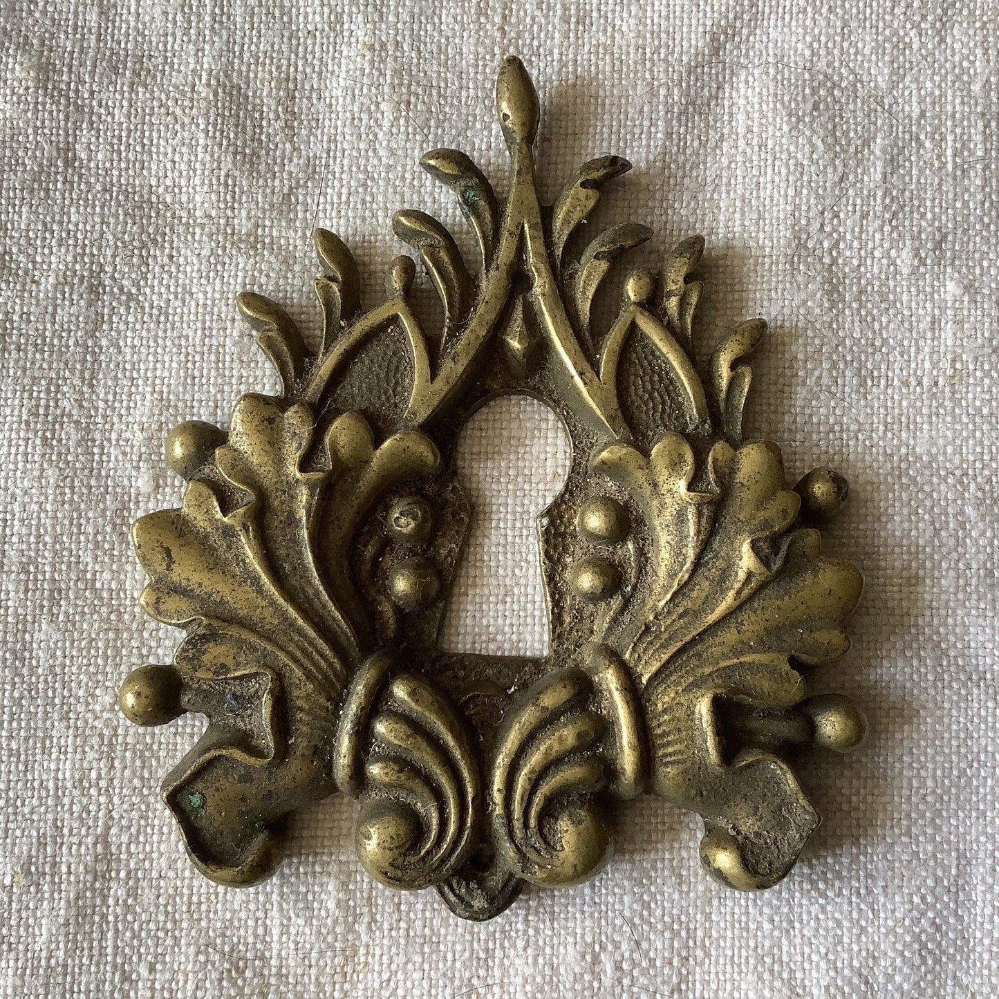 One Antique Brass Keyhole Cover made in France in the 1900s