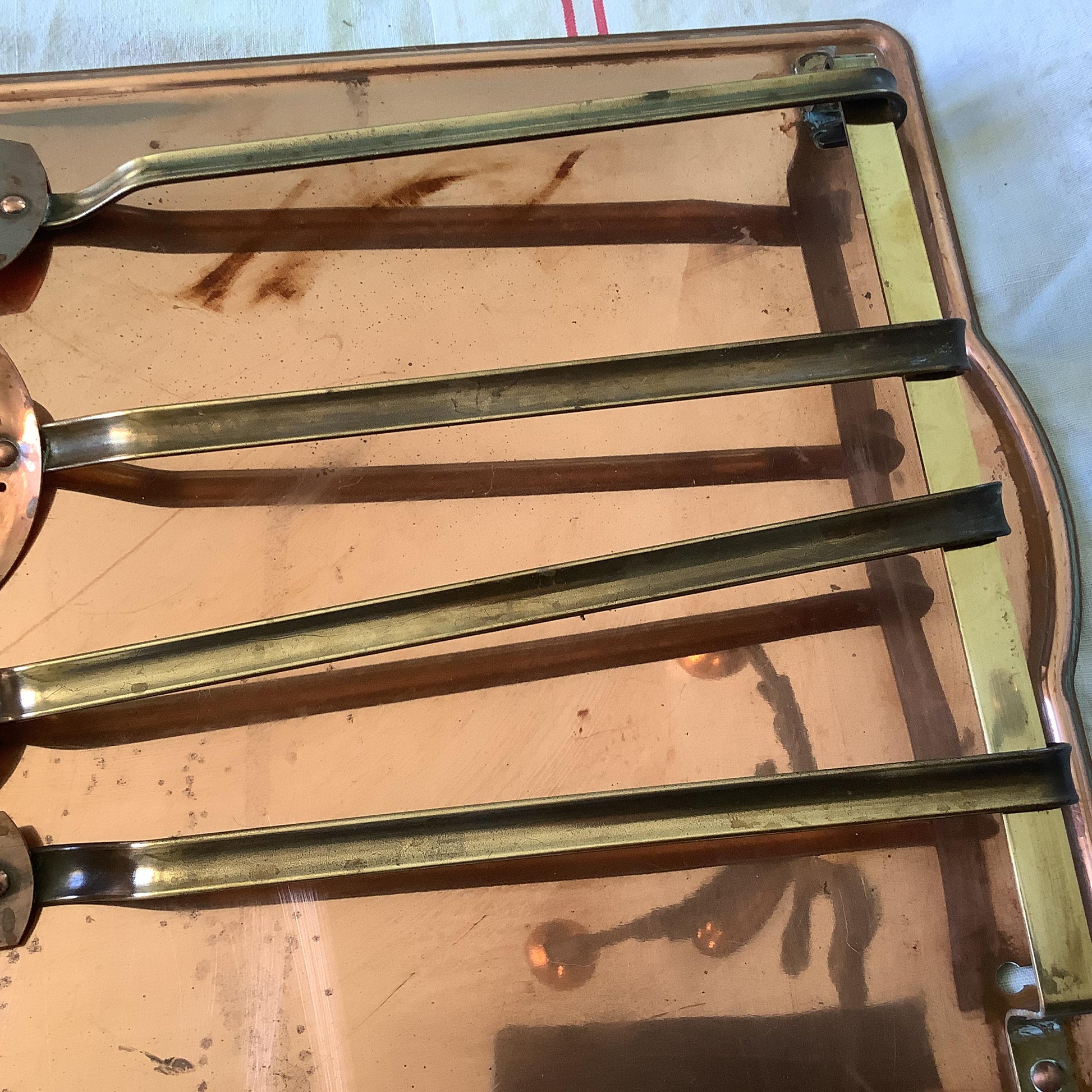 Vintage 1940s set of four copper cooking utensils, brass handles and copper rivets, display wall mounted drain stand made in France