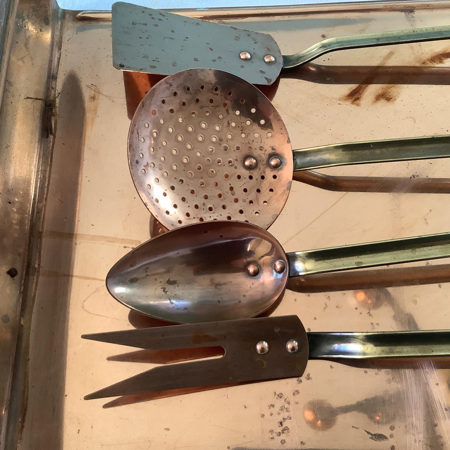 Vintage 1940s set of four copper cooking utensils, brass handles and copper rivets, display wall mounted drain stand made in France